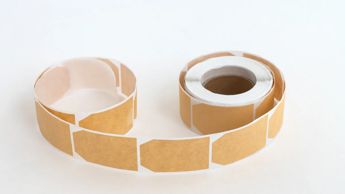 A roll of brown kraft paper labels